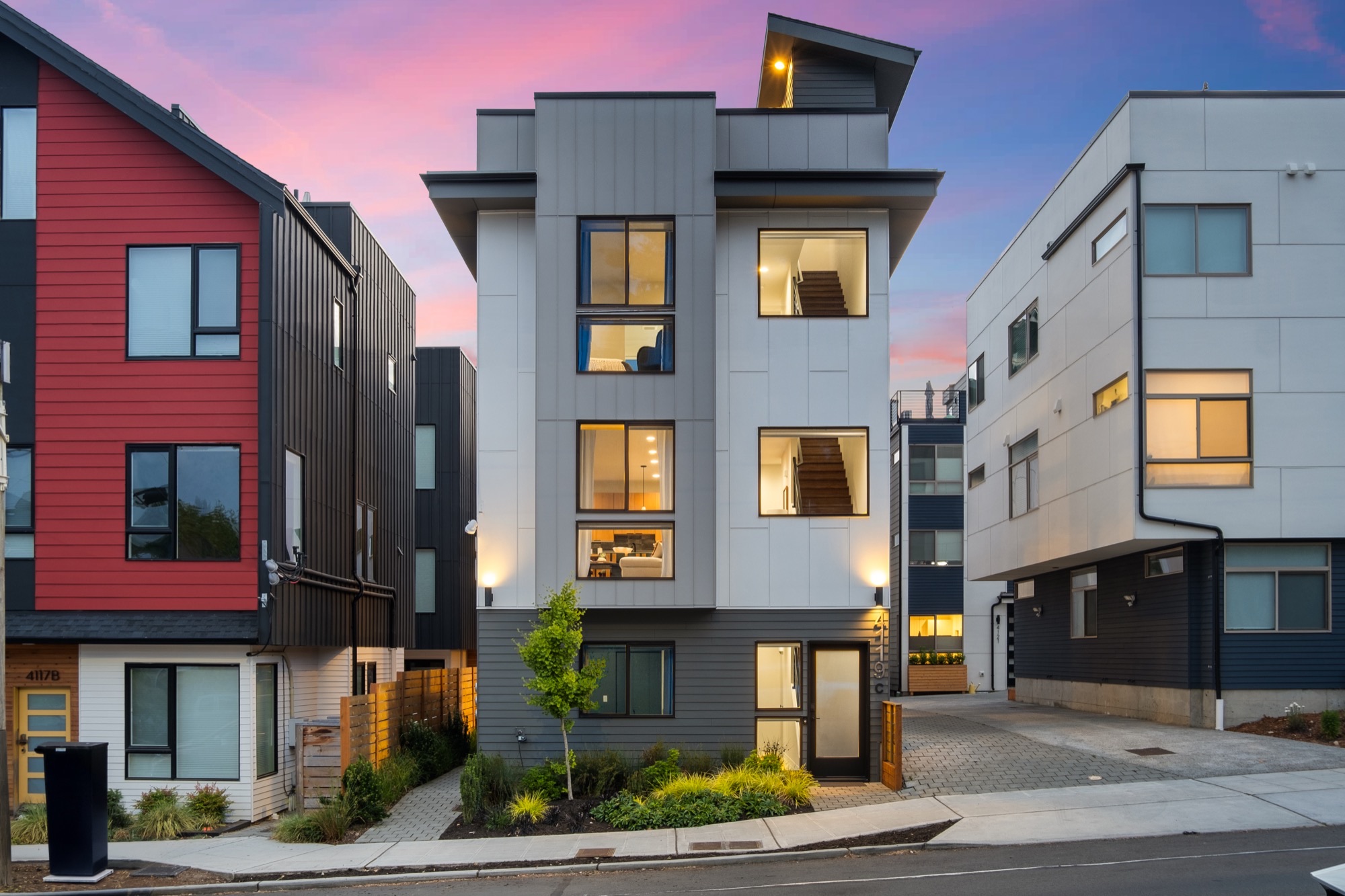 Modern townhome exterior at twilight