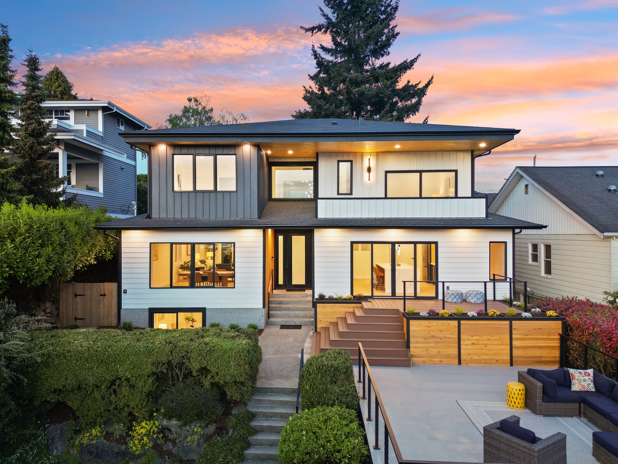 Aerial twilight view of a modern home and deck