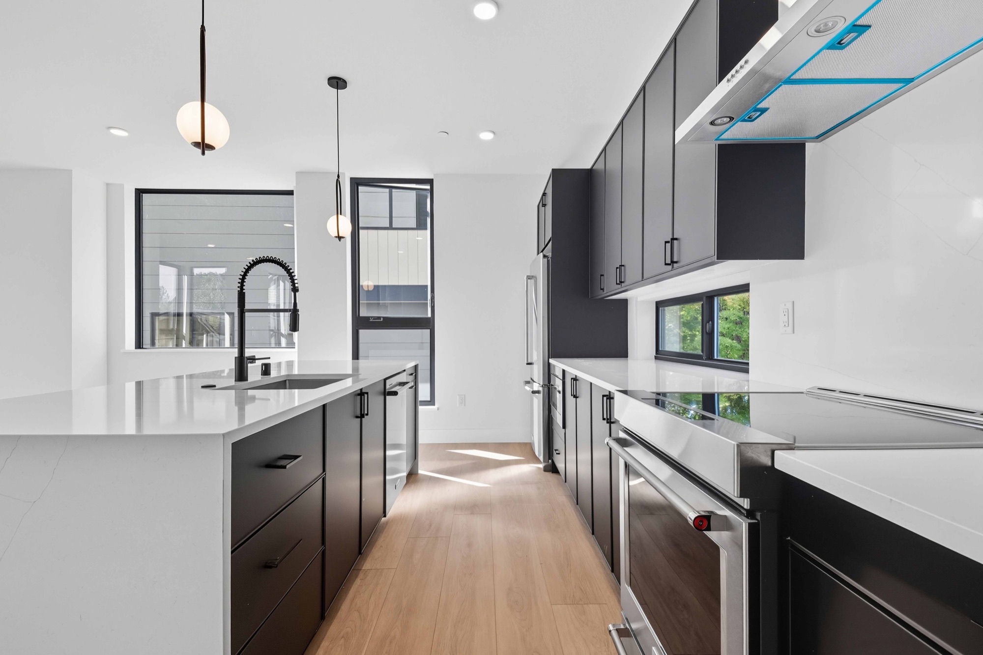 Contemporary galley kitchen with quartz counters